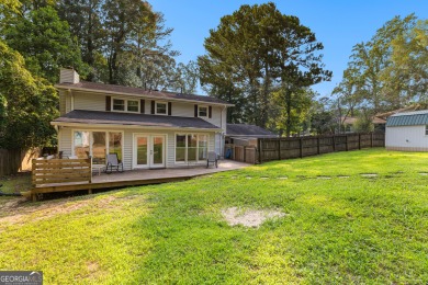 Discover this beautifully maintained brick 4-bedroom, 2.5-bath on Canongate At Flat Creek Club in Georgia - for sale on GolfHomes.com, golf home, golf lot