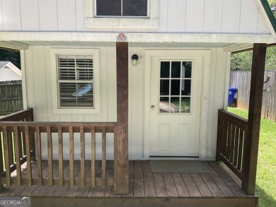 Discover this beautifully maintained brick 4-bedroom, 2.5-bath on Canongate At Flat Creek Club in Georgia - for sale on GolfHomes.com, golf home, golf lot