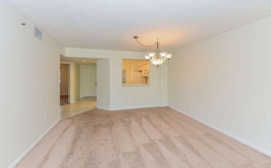 Welcome to beautiful Coral Cove to this spacious ground floor on Westchester Golf and Country Club in Florida - for sale on GolfHomes.com, golf home, golf lot