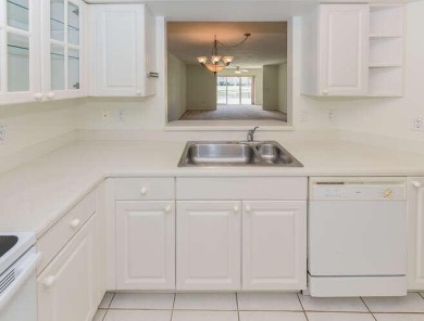 Welcome to beautiful Coral Cove to this spacious ground floor on Westchester Golf and Country Club in Florida - for sale on GolfHomes.com, golf home, golf lot