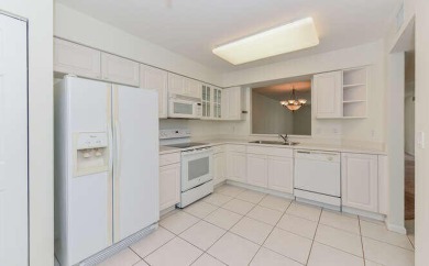 Welcome to beautiful Coral Cove to this spacious ground floor on Westchester Golf and Country Club in Florida - for sale on GolfHomes.com, golf home, golf lot
