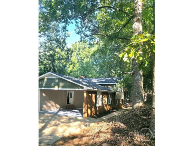 Welcome to this spacious 4-bedroom, 3-bathroom brick split-level on University of Georgia Golf Course in Georgia - for sale on GolfHomes.com, golf home, golf lot