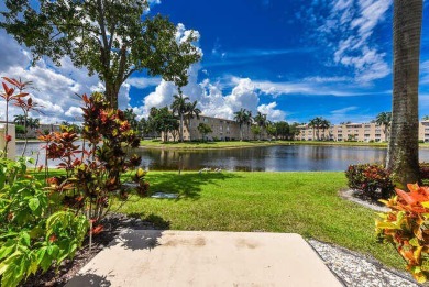 Welcome to beautiful Coral Cove to this spacious ground floor on Westchester Golf and Country Club in Florida - for sale on GolfHomes.com, golf home, golf lot