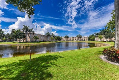Welcome to beautiful Coral Cove to this spacious ground floor on Westchester Golf and Country Club in Florida - for sale on GolfHomes.com, golf home, golf lot