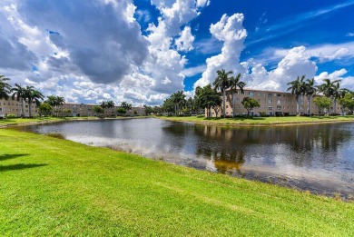Welcome to beautiful Coral Cove to this spacious ground floor on Westchester Golf and Country Club in Florida - for sale on GolfHomes.com, golf home, golf lot