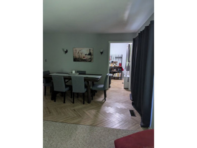 This bright, private unit has beautiful views! Natural light on Gainfield Farms Golf Course in Connecticut - for sale on GolfHomes.com, golf home, golf lot