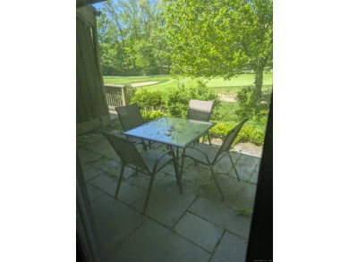 This bright, private unit has beautiful views! Natural light on Gainfield Farms Golf Course in Connecticut - for sale on GolfHomes.com, golf home, golf lot