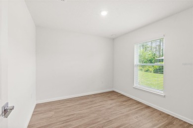 This almost new home (a year and half young) in beautiful on The Grand Club Cypress Course in Florida - for sale on GolfHomes.com, golf home, golf lot
