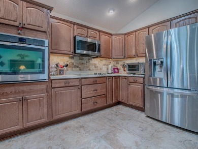 Welcome to this LOVELY LILAC DESIGNER HOME with a GOLF CART on Bella Glade Country Club in Florida - for sale on GolfHomes.com, golf home, golf lot