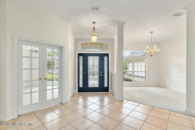 LOCATION, LOCATION - LOVELY MARSH VIEW HOME LOCATED IN THE on Queens Harbour Yacht and Country Club in Florida - for sale on GolfHomes.com, golf home, golf lot