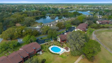Lake Sparkle 55+ Partially FURNISHED LAKEFRONT Condominium on Country Club At Silver Springs Shores in Florida - for sale on GolfHomes.com, golf home, golf lot