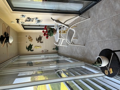 Afternoon setting sun from your huge wide enclosed patio on Kings Point Golf -Flanders Way in Florida - for sale on GolfHomes.com, golf home, golf lot