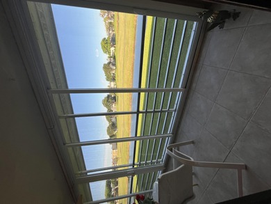 Afternoon setting sun from your huge wide enclosed patio on Kings Point Golf -Flanders Way in Florida - for sale on GolfHomes.com, golf home, golf lot