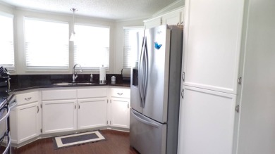 When entering this gorgeous 2-bedroom, 2-bath Palm Harbor Home on Schalamar Creek Golf and Country Club in Florida - for sale on GolfHomes.com, golf home, golf lot
