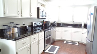 When entering this gorgeous 2-bedroom, 2-bath Palm Harbor Home on Schalamar Creek Golf and Country Club in Florida - for sale on GolfHomes.com, golf home, golf lot