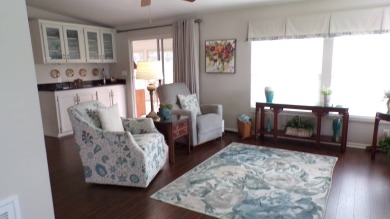 When entering this gorgeous 2-bedroom, 2-bath Palm Harbor Home on Schalamar Creek Golf and Country Club in Florida - for sale on GolfHomes.com, golf home, golf lot