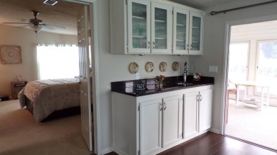 When entering this gorgeous 2-bedroom, 2-bath Palm Harbor Home on Schalamar Creek Golf and Country Club in Florida - for sale on GolfHomes.com, golf home, golf lot