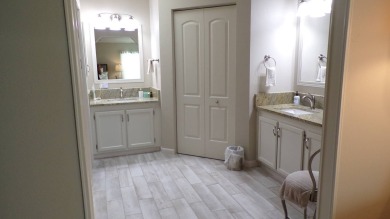 When entering this gorgeous 2-bedroom, 2-bath Palm Harbor Home on Schalamar Creek Golf and Country Club in Florida - for sale on GolfHomes.com, golf home, golf lot