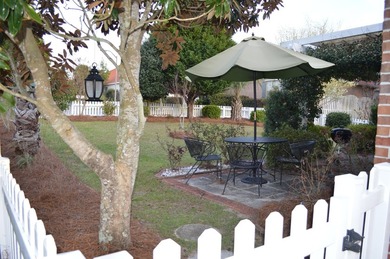 Beautiful home in quaint, white-picket-fenced, gated community on Fairway Oaks at Magnolia Golf Course in Florida - for sale on GolfHomes.com, golf home, golf lot