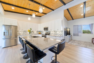 This stunning 3-bedroom, 2.5-bath home sits on the golf course on Discovery Harbour Golf Course in Hawaii - for sale on GolfHomes.com, golf home, golf lot