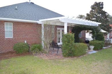 Beautiful home in quaint, white-picket-fenced, gated community on Fairway Oaks at Magnolia Golf Course in Florida - for sale on GolfHomes.com, golf home, golf lot