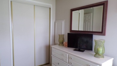 When entering this gorgeous 2-bedroom, 2-bath Palm Harbor Home on Schalamar Creek Golf and Country Club in Florida - for sale on GolfHomes.com, golf home, golf lot