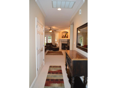 Beautiful home in quaint, white-picket-fenced, gated community on Fairway Oaks at Magnolia Golf Course in Florida - for sale on GolfHomes.com, golf home, golf lot