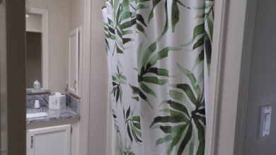 When entering this gorgeous 2-bedroom, 2-bath Palm Harbor Home on Schalamar Creek Golf and Country Club in Florida - for sale on GolfHomes.com, golf home, golf lot