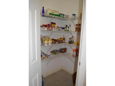 Beautiful home in quaint, white-picket-fenced, gated community on Fairway Oaks at Magnolia Golf Course in Florida - for sale on GolfHomes.com, golf home, golf lot