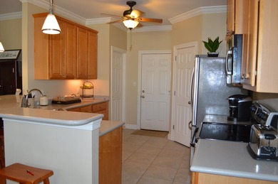 Beautiful home in quaint, white-picket-fenced, gated community on Fairway Oaks at Magnolia Golf Course in Florida - for sale on GolfHomes.com, golf home, golf lot