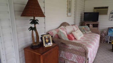 When entering this gorgeous 2-bedroom, 2-bath Palm Harbor Home on Schalamar Creek Golf and Country Club in Florida - for sale on GolfHomes.com, golf home, golf lot