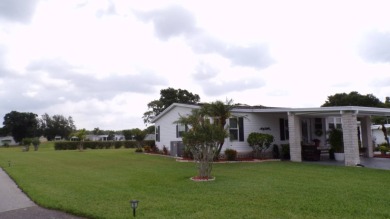 When entering this gorgeous 2-bedroom, 2-bath Palm Harbor Home on Schalamar Creek Golf and Country Club in Florida - for sale on GolfHomes.com, golf home, golf lot