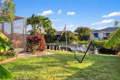 Escape to this Gulf access haven, with prime waterfront on Deep Creek Golf Club in Florida - for sale on GolfHomes.com, golf home, golf lot