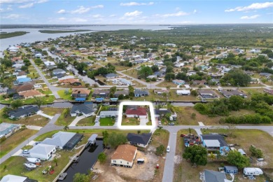 Escape to this Gulf access haven, with prime waterfront & on Deep Creek Golf Club in Florida - for sale on GolfHomes.com, golf home, golf lot