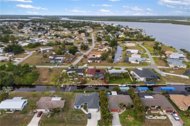 Escape to this Gulf access haven, with prime waterfront & on Deep Creek Golf Club in Florida - for sale on GolfHomes.com, golf home, golf lot