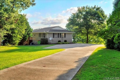 When you turn in to Fox Hollow and where the road ends on Myrick Hills Country Club in North Carolina - for sale on GolfHomes.com, golf home, golf lot