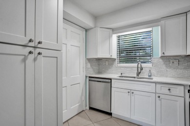 GROUND LEVEL CONDO WITH STUNNING LAKE & GOLF VIEWS Discover on Atlantis Golf Club in Florida - for sale on GolfHomes.com, golf home, golf lot