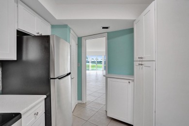 GROUND LEVEL CONDO WITH STUNNING LAKE & GOLF VIEWS Discover on Atlantis Golf Club in Florida - for sale on GolfHomes.com, golf home, golf lot