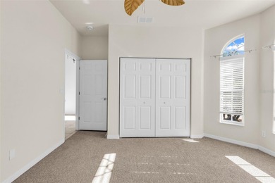 Experience the Florida lifestyle at its finest in this on Kings Gate Golf Club in Florida - for sale on GolfHomes.com, golf home, golf lot