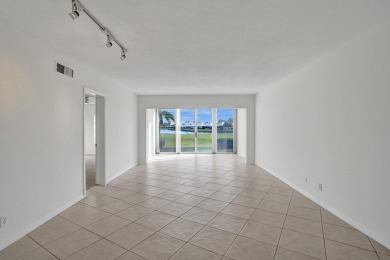 GROUND LEVEL CONDO WITH STUNNING LAKE & GOLF VIEWS Discover on Atlantis Golf Club in Florida - for sale on GolfHomes.com, golf home, golf lot