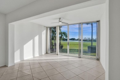 GROUND LEVEL CONDO WITH STUNNING LAKE & GOLF VIEWS Discover on Atlantis Golf Club in Florida - for sale on GolfHomes.com, golf home, golf lot
