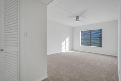 GROUND LEVEL CONDO WITH STUNNING LAKE & GOLF VIEWS Discover on Atlantis Golf Club in Florida - for sale on GolfHomes.com, golf home, golf lot