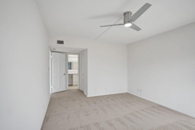 GROUND LEVEL CONDO WITH STUNNING LAKE & GOLF VIEWS Discover on Atlantis Golf Club in Florida - for sale on GolfHomes.com, golf home, golf lot