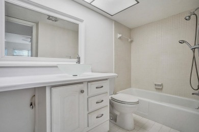GROUND LEVEL CONDO WITH STUNNING LAKE & GOLF VIEWS Discover on Atlantis Golf Club in Florida - for sale on GolfHomes.com, golf home, golf lot