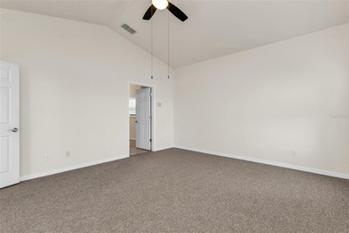 Experience the Florida lifestyle at its finest in this on Kings Gate Golf Club in Florida - for sale on GolfHomes.com, golf home, golf lot