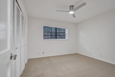 GROUND LEVEL CONDO WITH STUNNING LAKE & GOLF VIEWS Discover on Atlantis Golf Club in Florida - for sale on GolfHomes.com, golf home, golf lot