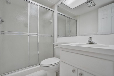 GROUND LEVEL CONDO WITH STUNNING LAKE & GOLF VIEWS Discover on Atlantis Golf Club in Florida - for sale on GolfHomes.com, golf home, golf lot