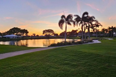 GROUND LEVEL CONDO WITH STUNNING LAKE & GOLF VIEWS Discover on Atlantis Golf Club in Florida - for sale on GolfHomes.com, golf home, golf lot