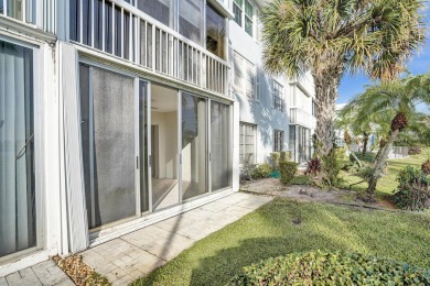 GROUND LEVEL CONDO WITH STUNNING LAKE & GOLF VIEWS Discover on Atlantis Golf Club in Florida - for sale on GolfHomes.com, golf home, golf lot