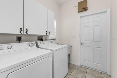 Experience the Florida lifestyle at its finest in this on Kings Gate Golf Club in Florida - for sale on GolfHomes.com, golf home, golf lot